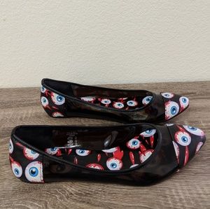 Shoes with eyesballs on them